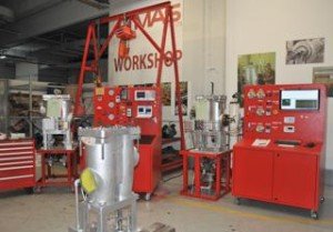 Workshop test bench setup with pressure vessels and a control panel at Asia Turbines